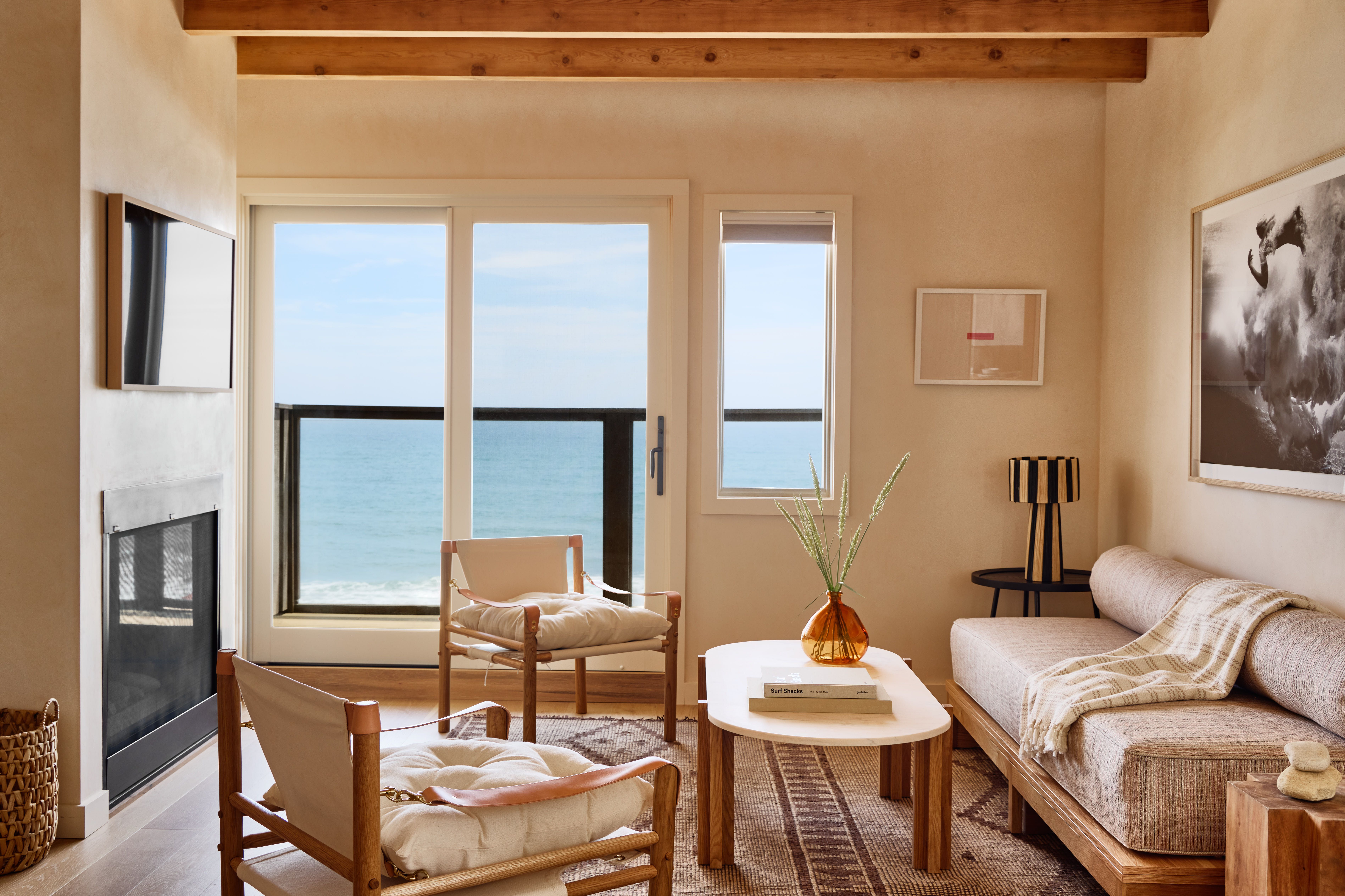 A Marram Montauk suite with a bed and daybed reflected in a mirror